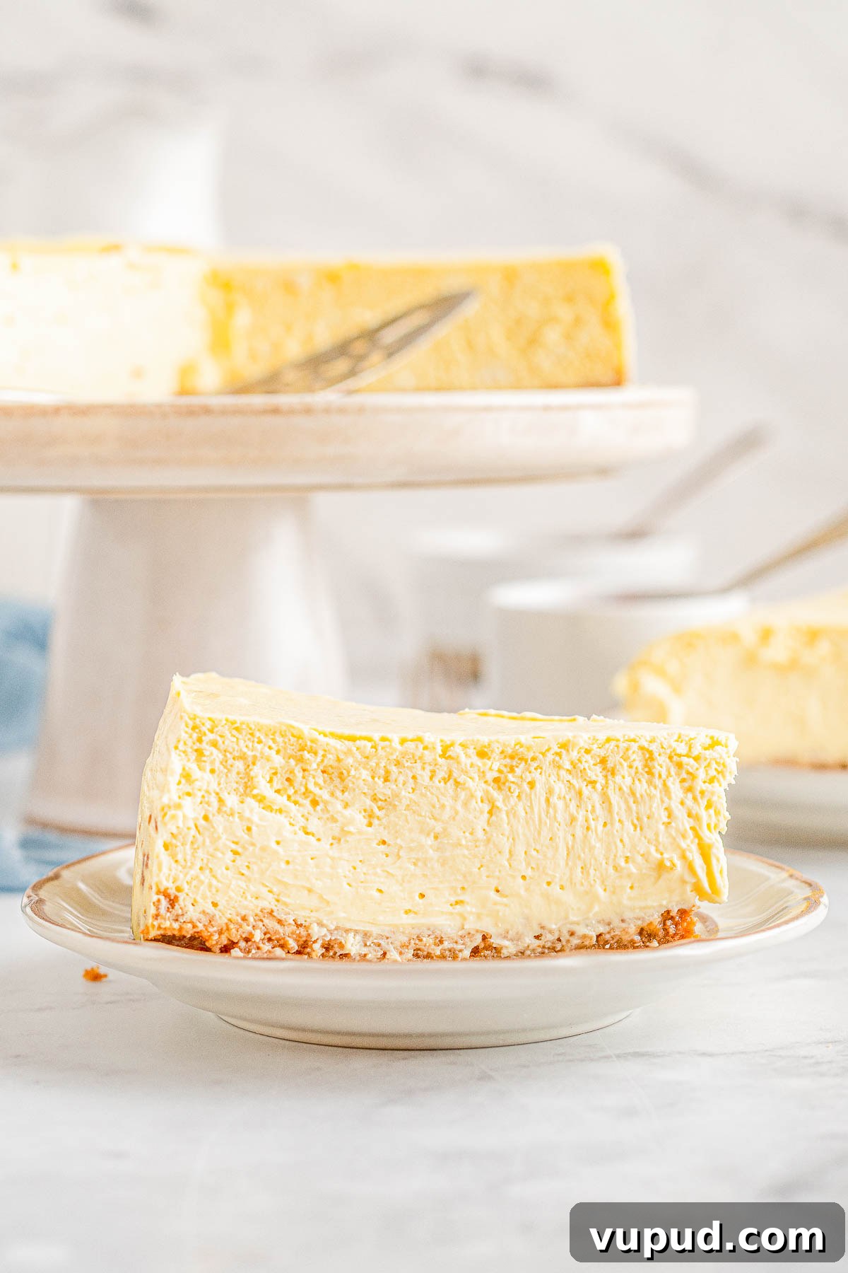 Classic New York Cheesecake Recipe: Creamy Oven-Baked Slice 22 A slice of homemade New York cheesecake on a plate.